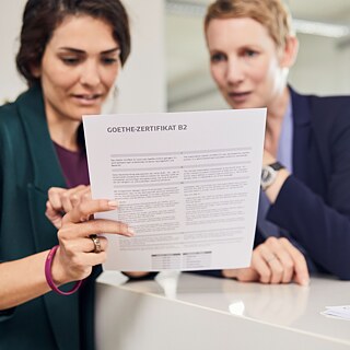 Two women look at a document