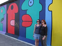 Brianna and her mother posing in front of the East Side Gallery