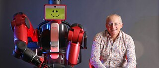 Toby Walsh with UNSW robot Baxter
