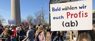 “We’ll soon be voting you professionals out”: a secondary school student carries a sign at a "Fridays for Future" demonstration. 