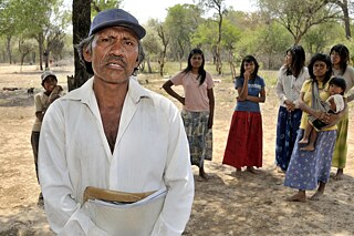 Racism – Cacique with documents with which he wants to legally assert his Indigenous community’s claim to land. If he does not succeed, the Wichi will lose their territory to big landowners. El Escrito, Gran Chaco, Salta Argentina, photograph from 2010.