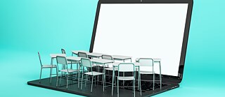 Tables and chairs placed atop a laptop keyboard