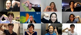 Teachers and course participants in a conferencing tool smiling and pointing in different directions during an online class