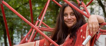 A woman in a climbing frame