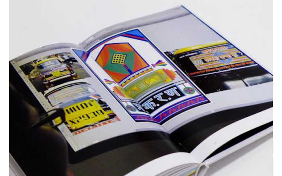 A photo of a book with colourful patterns from his exhibition 