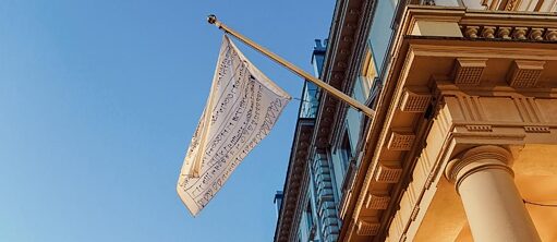 The flag made by the CSK Family hanging outside of our building 