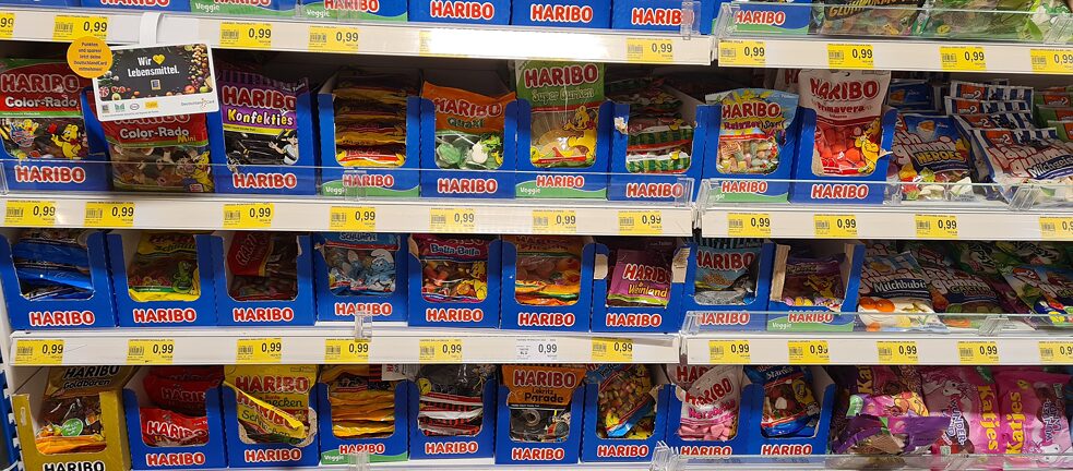 Supermarket shelf full of sweets