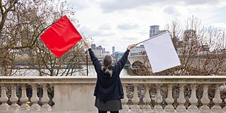 woman holding flags 