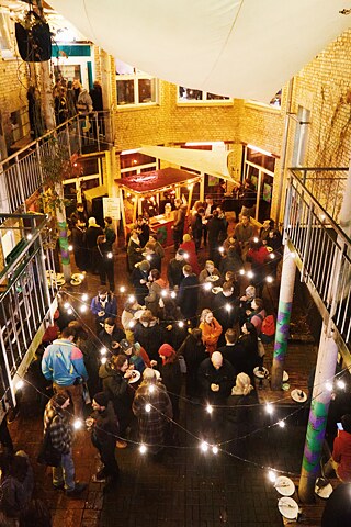 Shot of an inner courtyard from above with people in conversation