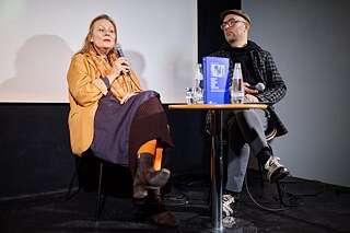 Cordelia Dvorak and Felix Ackermann on stage at the presentation of the book “Wenn du durch die Hölle gehst, dann geh weiter”