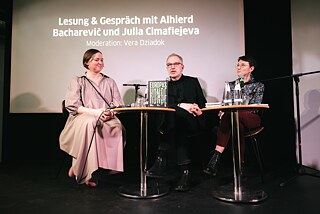 Author Alhierd Bacharevič and author Julia Cimafiejeva in conversation with Vera Dziadok on stage