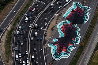 A colourful hole by Hamburg duo TenTen 1010 on the Paris urban expressway Périphérique