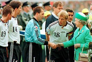 Britain's Queen Elizabeth II greets the German soccer team before the start of the European Football Championship final at Wembley Stadium in London