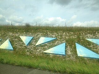 Cubes and cylinders by Guy de Rougemont on the French Autoroute A4 near the city of Reims