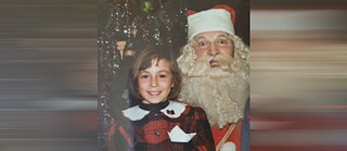 Photo is showing the small girl Vesna next to a man in costume with a full white beard – “Grandfather Frost” (Djeda Mraz) – still in Sarajevo 