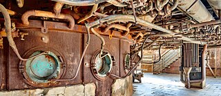 The interior of the old factory building exudes steampunk atmosphere.