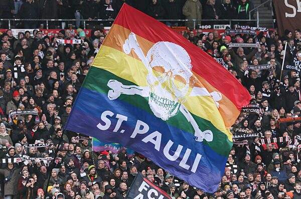 St. Pauli fans with rainbow flag at the Millerntor stadium near Hamburg's Reeperbahn in February 2024 