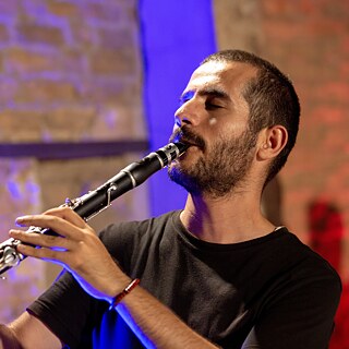 Gaelan Kameran playing the clarinet 