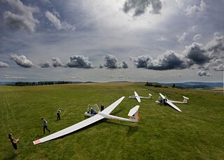 Several gliders at the glider airfield on the Wasserkuppe