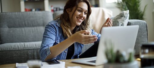 Woman with headphones in online meeting