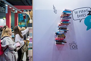 Publisher's stand at Frankfurt Book Fair and readers