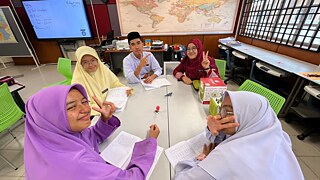 SM Sains Kepala Batas students and teacher working on the project