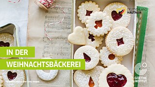 Sheet music, Christmas cookies and red and white parcel tape.