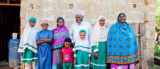 Hoping for a brighter future – Shaame Kombo Hassan and his family outside their house in Mtondia, Kilifi