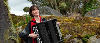 World famous German accordionist Eva Zöllner holding her accordeon