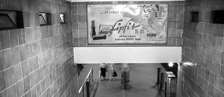 The U-Bahn station Rosenthaler Platz was the second Berlin ghost station to reopen in 1989 after the fall of the Berlin Wall. This advertising poster was still in place in 1990 – and presumably had been there throughout the 28 years that the station was closed.