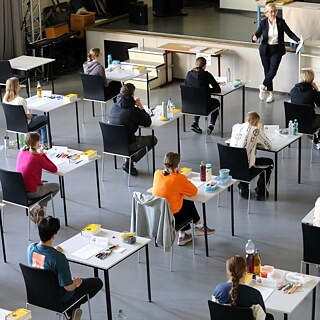 Pupils sit at separate tables