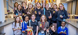 A group of pupils showing the muffins they baked