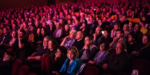 The audience at Berlin & Beyond are immersed in the programme in glowing festival pink. 