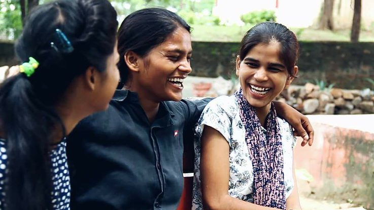 Sunita (middle) with her fellow delivery girls