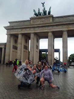 Merren with a tour group at the Brandenburg Gate. 