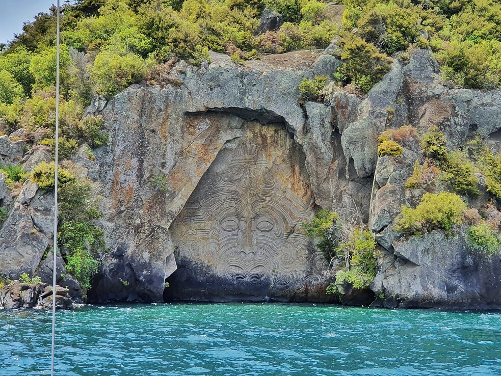 Maori Rock Carving - The 14-metre high carving in Mine Bay, as you're viewing the carving the tours guides give you a lot of context to grasp the significance of the carving