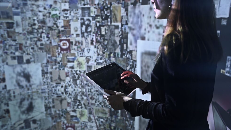 A member of the public tests out Refik Anadol's "Archive Dreaming" project