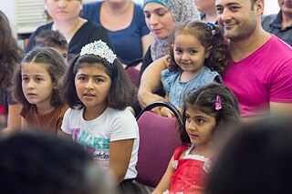 Racism - Children of refugee families during an enrolment celebration at the primary school Kastanienallee.