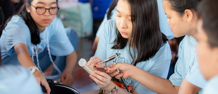 Students examine the water quality of the Chao Phraya River.