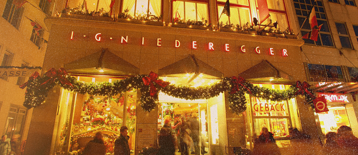 A photo of the front of the Niederegger marzipan store in Lübeck during the Christmas season.