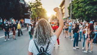 Person raising their fist in the air