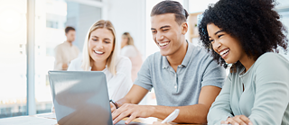 Diverse group of your people people smiling at laptop